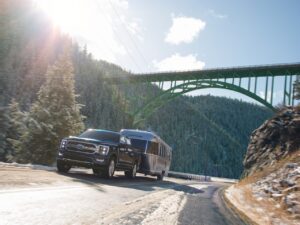 The 2021 F-150 pulling an Airstream. The F-150 is the best selling car in America.