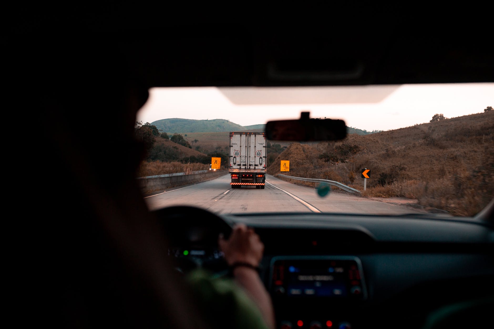 photo of person driving a vehicle